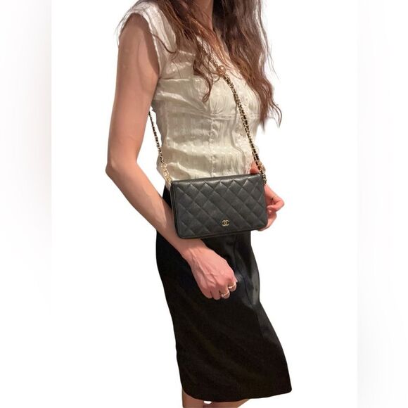 CHANEL Handbags - CHANEL Black and Gold Quilted Clutch